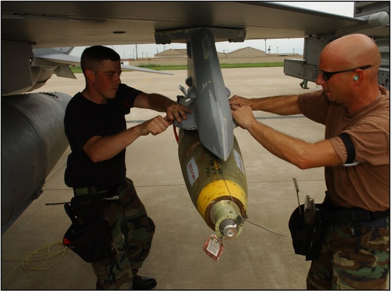 Montana Air National Guard Armament Systems Specialists Staff Sgt. Carl Valvoda and Tech. Sgt. Mike Geske secure a Mk-82 general purpose bomb during a deployment to Kunsan Air Base, Republic of Korea July 5, 2006. (U.S. Air Force photo/Staff Sgt. Becky Nelson)

