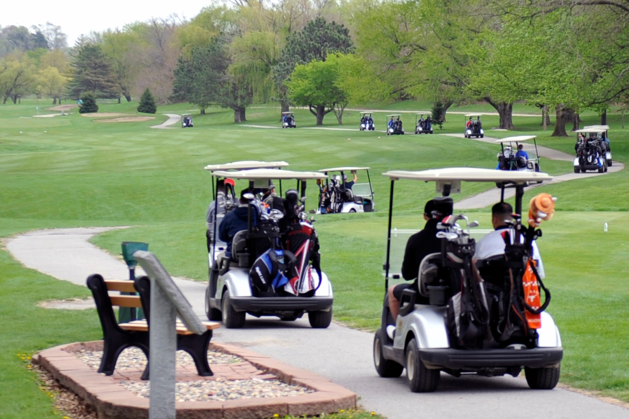 Golfers take off towards their starting hole for the shotgun start of the course as they start the tournament. Patrons gathered for the Sexual Assault Awareness and Prevention Month golf tournament at Willow Lakes April 29, Offutt Air Force Base, Neb. The 55th Wing Sexual Assault Prevention and Response program actively commits to the safety and well-being of all military members, civilians and family members assigned to the base. (U.S. Air Force photo by Jeff W. Gates/Released)