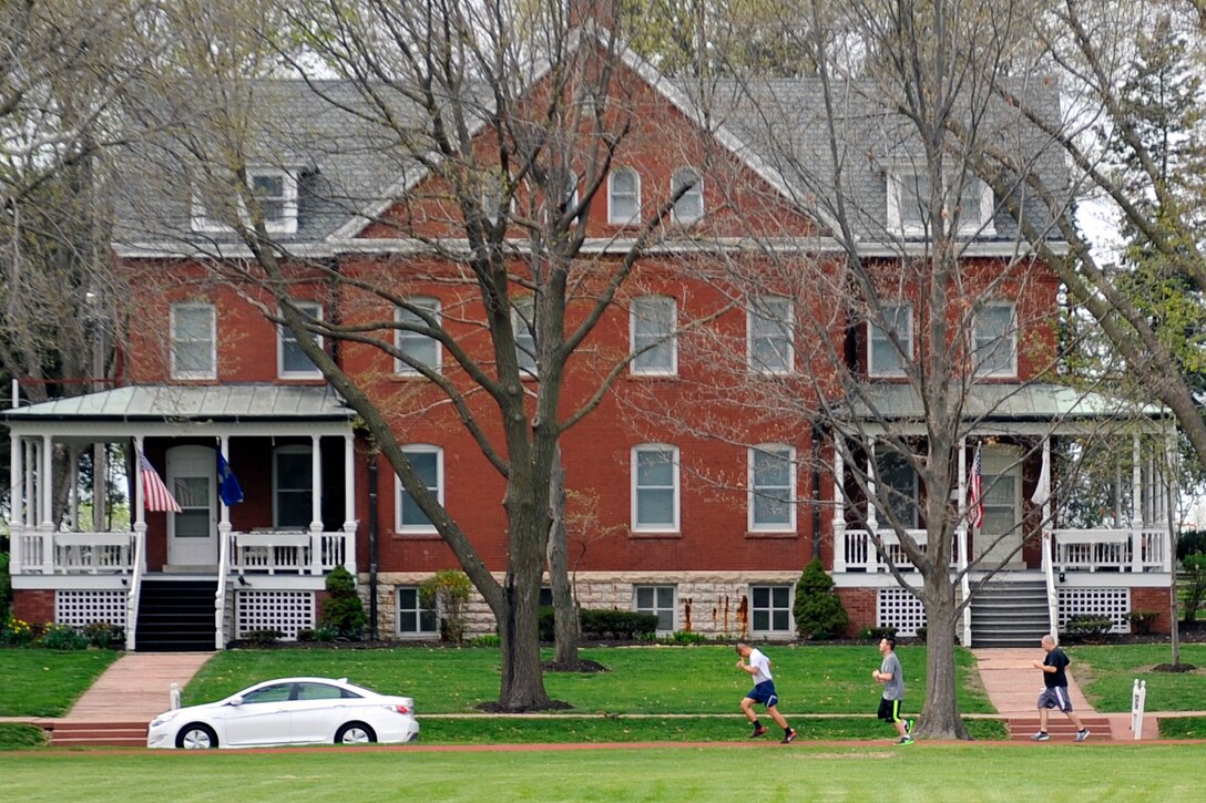 Runners hit their stride during the Sexual Assault Awareness and Prevention Month 5k relay race on the parade grounds April 17, Offutt Air Force Base, Neb. The race was just one of many events held throughout the month designed to raise awareness and combat sexual assault. (U.S. Air Force photo by Jeff W. Gates/Released)