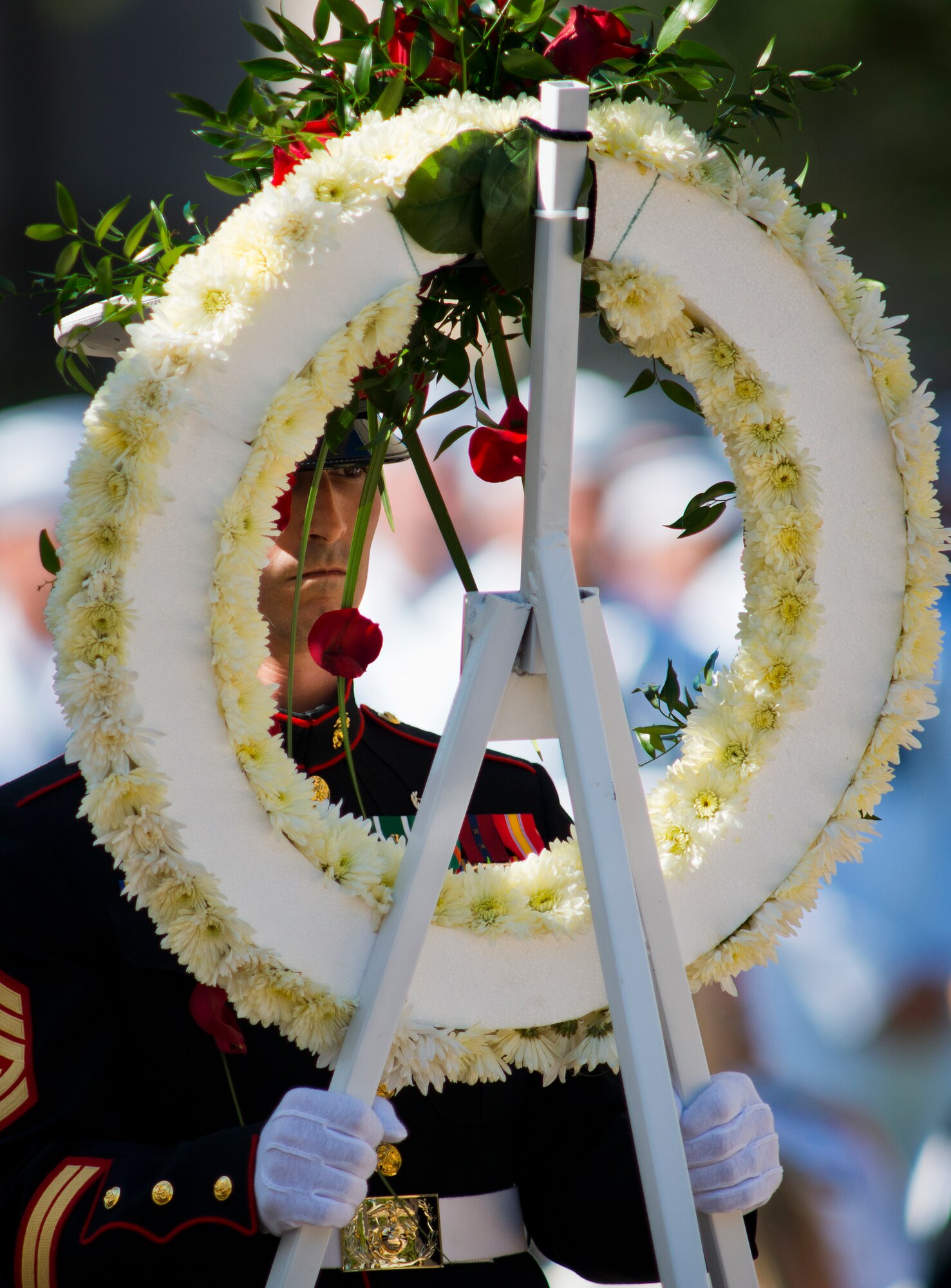 A Soldier carries in a wreath to be placed in front of the Army’s list of lost explosive ordnance disposal technicians during the 46th Annual EOD Memorial Service at the Kauffman EOD Training Complex at Eglin Air Force Base, Fla., May 2.  The Army added five names to their list during the event.  The Marines and Navy added three more for a total of eight this year.  The all-service total now stands at 314.  (U.S. Air Force photo/Tech. Sgt. Samuel King Jr.)