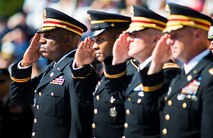 A row of Soldiers salute during the National Anthem at the Explosive Ordnance Disposal’s 46th Annual Memorial Service at the Kauffman EOD Training Complex at Eglin Air Force Base, Fla., May 2.  Eight names of Army, Marine and Navy service members were added to the EOD memorial wall. The all-service total now stands at 314.  (U.S. Air Force photo/Tech. Sgt. Samuel King Jr.)