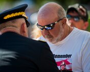 Wendall Helton, father of Spc. Justin Helton, receives a folded flag during the Explosive Ordnance Disposal’s 46th Annual Memorial Service at the Kauffman EOD Training Complex at Eglin Air Force Base, Fla., May 2.  Helton was killed in action in Afghanistan in 2014.  Helton and seven other names of Army, Marine and Navy service members were added to the EOD memorial wall. The all-service total now stands at 314. (U.S. Air Force photo/Tech. Sgt. Samuel King Jr.)
