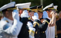 Navy, Marine and Army leadership salute as the National Anthem is played during the Explosive Ordnance Disposal’s 46th Annual Memorial Service at the Kauffman EOD Training Complex at Eglin Air Force Base, Fla., May 2.  Eight names of Army, Marine and Navy service members were added to the EOD memorial wall. The all-service total now stands at 314.  (U.S. Air Force photo/Tech. Sgt. Samuel King Jr.)