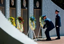 Chief Master Sgt. Neil Jones places a wreath in front of the Air Force’s list of lost explosive ordnance disposal technicians during the 46th Annual EOD Memorial Service at the Kauffman EOD Training Complex at Eglin Air Force Base, Fla., May 2.  The Army, Marines and Navy added eight new names this year.  The all-service total now stands at 314.  (U.S. Air Force photo/Tech. Sgt. Samuel King Jr.)