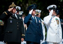 Army, Air Force and Navy service members salute during the retiring of the colors at the Explosive Ordnance Disposal’s 46th Annual Memorial Service at the Kauffman EOD Training Complex at Eglin Air Force Base, Fla., May 2.  Eight names of Army, Marine and Navy service members were added to the EOD memorial wall. The all-service total now stands at 314.  (U.S. Air Force photo/Tech. Sgt. Samuel King Jr.)