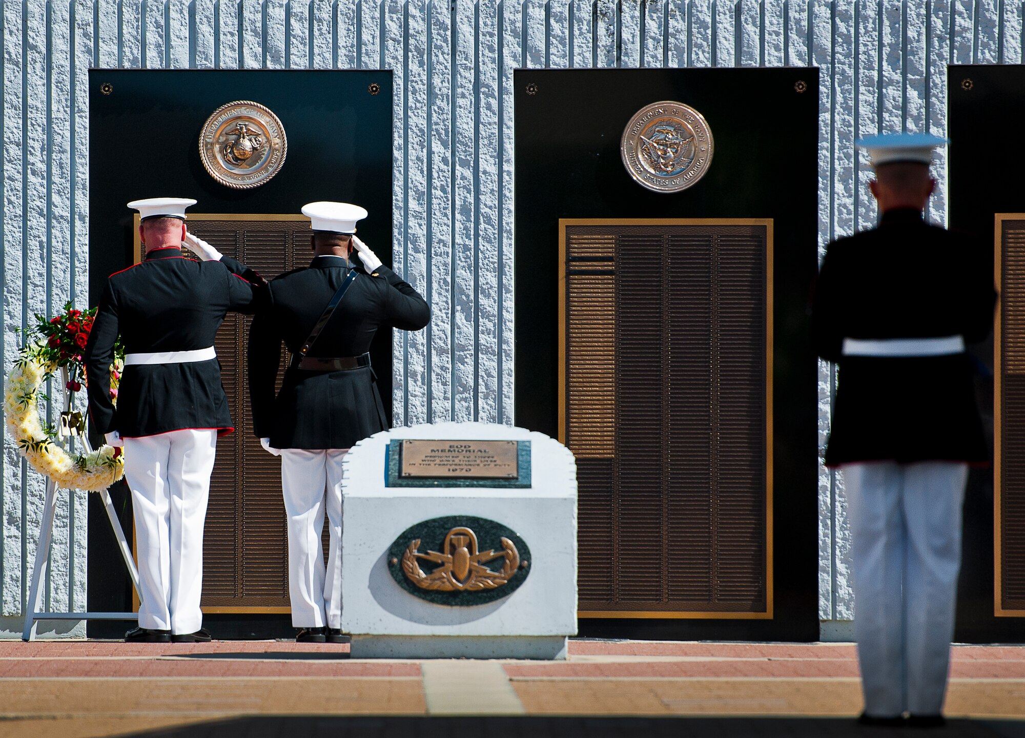 Master Gunnery Sgt. Steven Williams and Maj. Curtis Smith salute the Marine list of lost explosive ordnance disposal technicians during the 46th Annual EOD Memorial Service at the Kauffman EOD Training Complex at Eglin Air Force Base, Fla., May 2.  The Army, Marines and Navy added eight new names this year.  The all-service total now stands at 314. (U.S. Air Force photo/Tech. Sgt. Samuel King Jr.) 