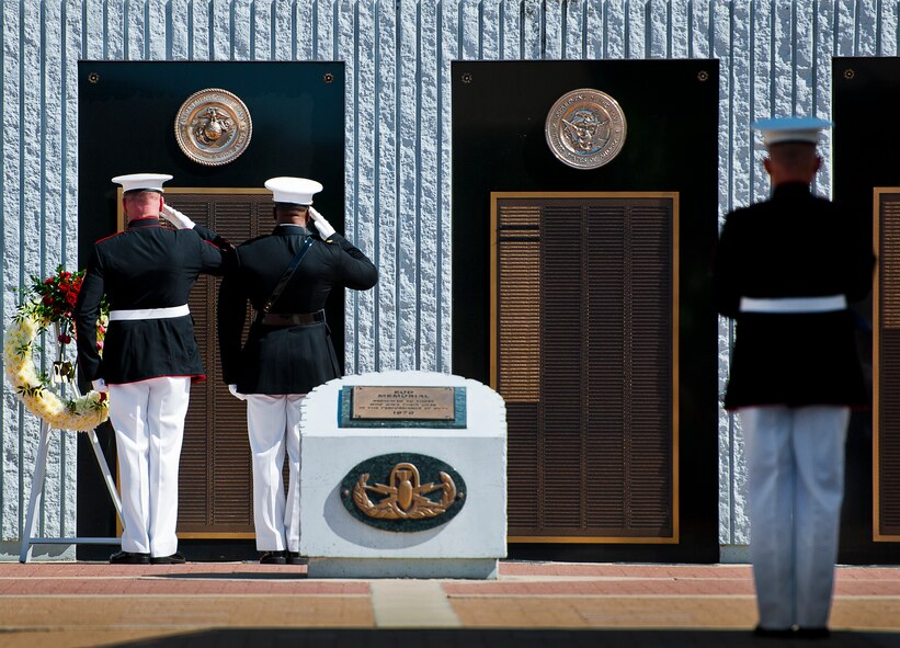 Master Gunnery Sgt. Steven Williams and Maj. Curtis Smith salute the Marine list of lost explosive ordnance disposal technicians during the 46th Annual EOD Memorial Service at the Kauffman EOD Training Complex at Eglin Air Force Base, Fla., May 2.  The Army, Marines and Navy added eight new names this year.  The all-service total now stands at 314. (U.S. Air Force photo/Tech. Sgt. Samuel King Jr.) 