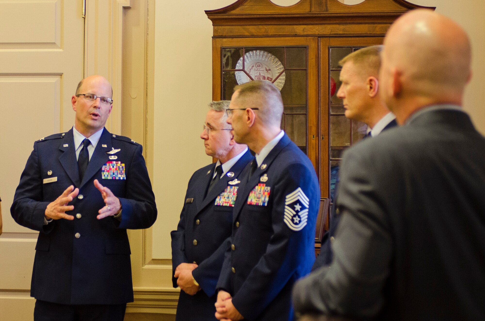 Col. Raymond A. Kozak, 512th Airlift Wing Commander, speaks to Delaware Gov. Jack Markell April 30, in the Governor's office, about the various issues children of military members overcome in order to be successful in their schooling. Last year, Markell signed a proclamation that declared April 30 as the Day of Recognition of the Military Child to show appreciation for the many challenges that are unique to their situation, such as having a parent deployed for extended periods of time and moving frequently. (U.S. Air Force photo by: Capt. Bernie Kale)