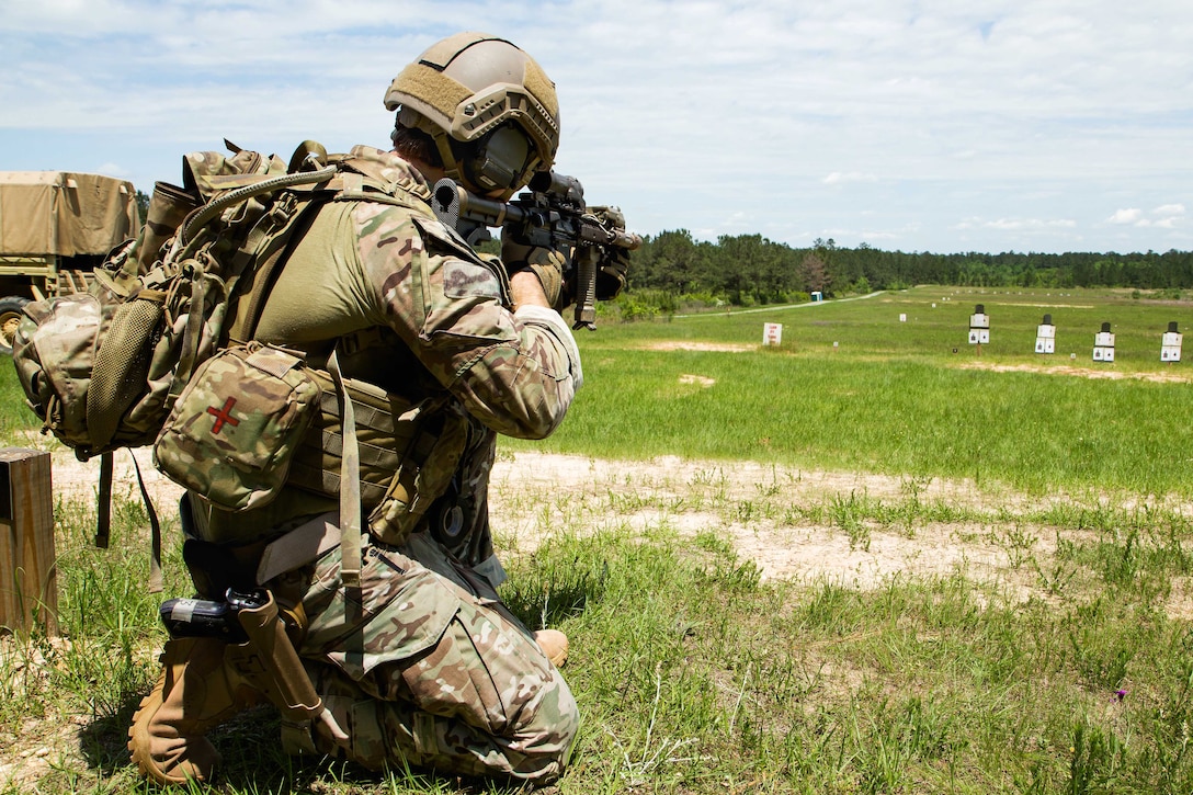 An Army National Guard Green Beret soldier fires at a shooting range during a bilateral training exchange in support of U.S. Army Special Operations Command South on Camp Shelby, Miss., April 23, 2015.