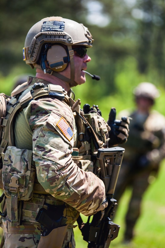 A U S Army  National Guard Green Beret soldier  trains a 