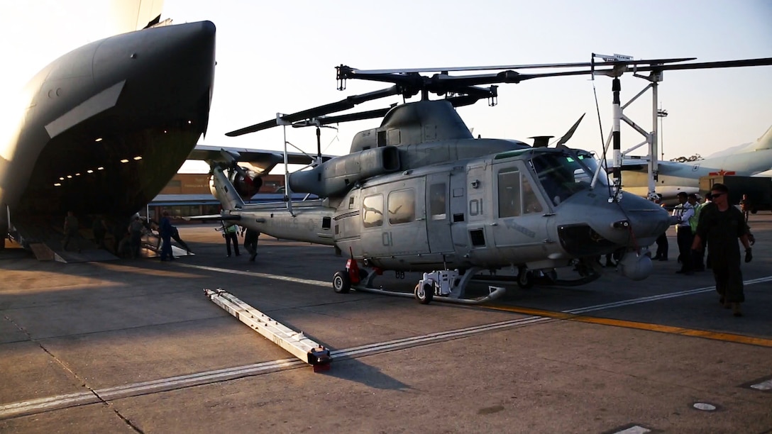 U.S. Marines unload a UH-1Y Huey onto Tribhuvan International Airport in Kathmandu, Nepal, May 3, 2015. The Marines brought a Huey, tools and equipment to support the Nepalese government's request for help after a magnitude-7.8 earthquake, April 25. The Marines are with Marine Light Attack Helicopter Squadron 469, Marine Air Group 36, 1st Marine Aircraft Wing, 3rd Marine Expeditionary Force.  