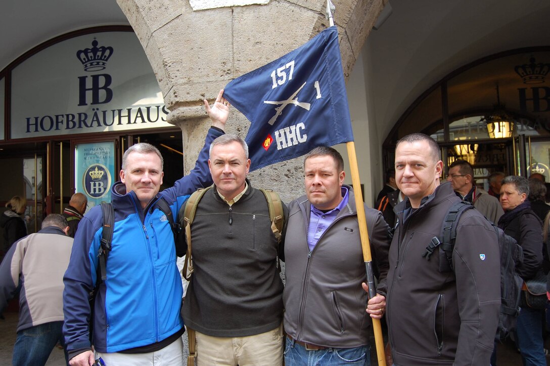 Members of the Colorado Army National Guard's 1st Battalion, 157th Infantry Regiment proudly display their unit guidon in front of the Hofbrauhaus in Munich, Germany, May 1, 2015. Seventy years ago, the 157th had set up a temporary command post after liberating prisoners of Dachau concentration camp in Munich during World War II.