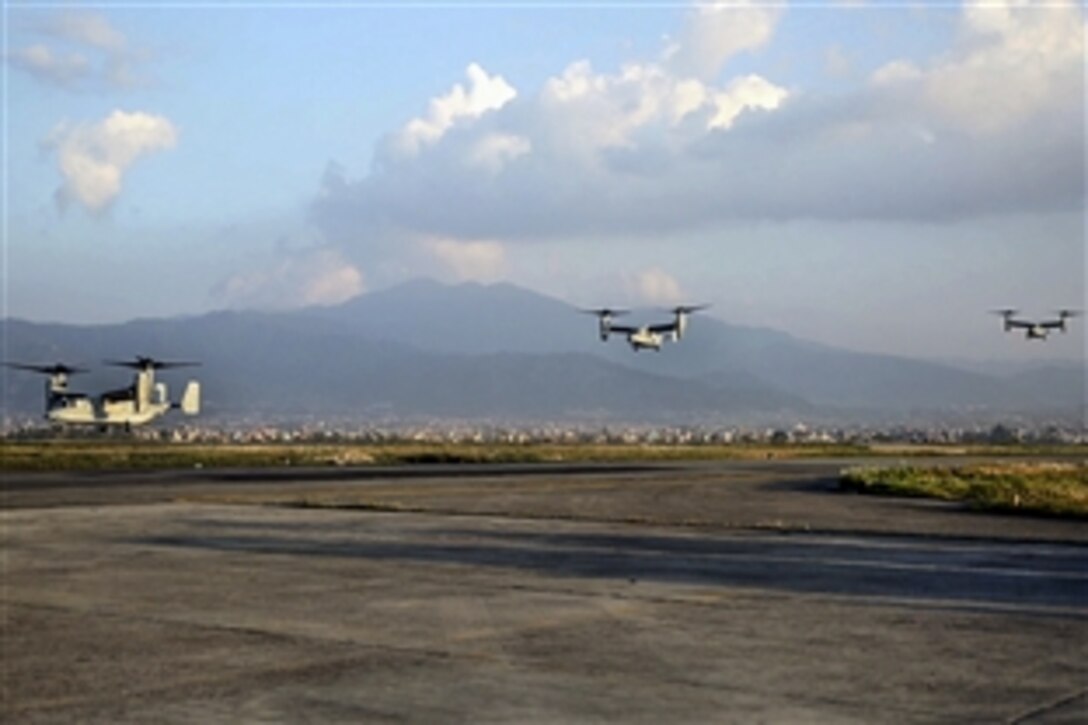 U.S. Marine V-22 Ospreys fly into Tribhuvan International Airport in Kathmandu, Nepal, May 3, 2015. The Marines brought  tools and equipment to respond to the Nepalese government's request for help after a magnitude-7.8 earthquake, April 25. The Marines are assigned to Marine All-Weather Fighter Attack Squadron 262, Marine Aircraft Group 12, 1st Marine Aircraft Wing, 3rd Marine Expeditionary Force. 