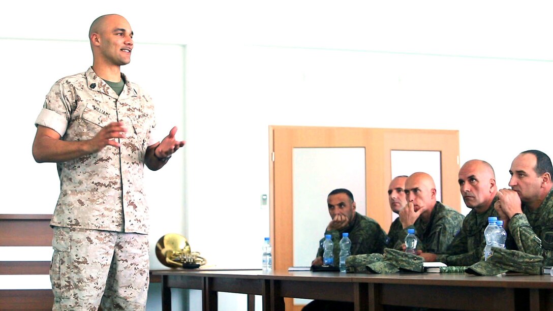 U.S. Marine Gunnery Sgt. David Williams, combat engineer chief with Black Sea Rotational Force, explains how U.S. Marines construct the combat operations center during a military-to-military engagement at Camp Adem Jashari in Pristina, Kosovo April 14-24, 2015. According to Maj. Adam Giroux, the Bilateral Affairs Officer at the U.S. Embassy in Pristina, these engagements are vital in Kosovo’s effort to NATO interoperability. (Official Marine Corps photo by 1st Lt. Sarah E. Burns)