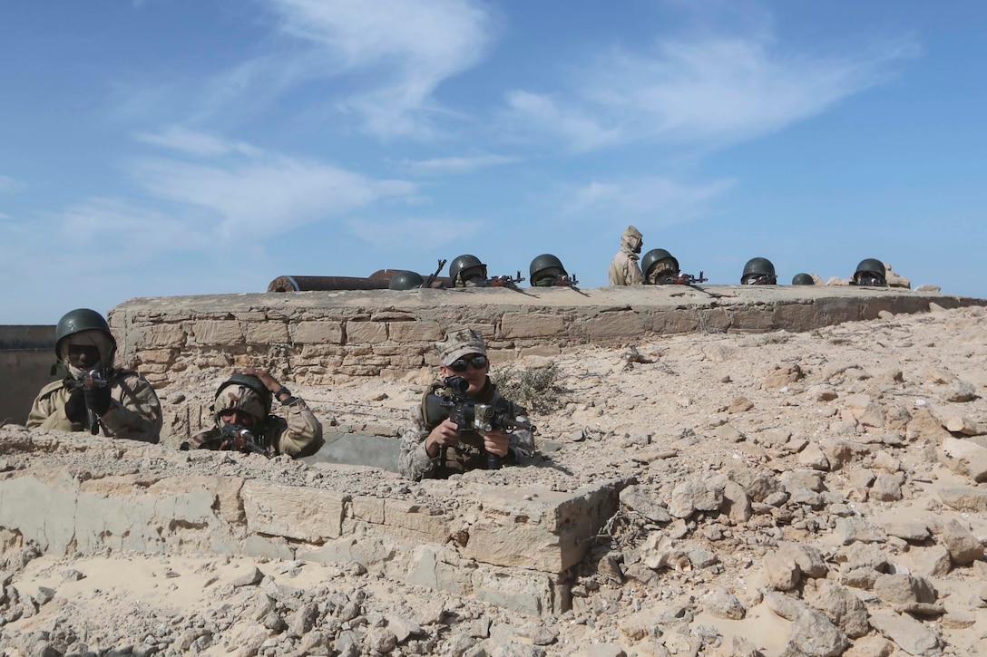 U.S. Marines and Mauritanian Fusilier Marins rehearse fields of fire during infantry training in Nouadhibou, Mauritania, Feb. 23, 2015. Approximately 20 U.S. Marines, Sailors and Coastguardsmen with Special-Purpose Marine Air-Ground Task Force Crisis Response-Africa trained with the Mauritanians, practicing infantry skills, small boat operations, combat marksmanship, and tactical combat casualty care. (Courtesy photo)