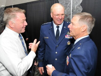 Air Force Gen. Craig R. McKinley, the chief of the National Guard Bureau, Air Force Brig. Gen. Timothy J. Cossalter, Minnesota's assistant adjutant general for air, and a member of the Duluth, Minn., Area Chamber of Commerce speak after chamber's 140th anniversary celebration Oct. 21, 2010.