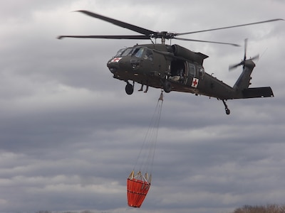 Two weeks before responding to an actual forest fire, the Massachusetts Army National Guard was practicing dropping water from its bucket in April, 2015.