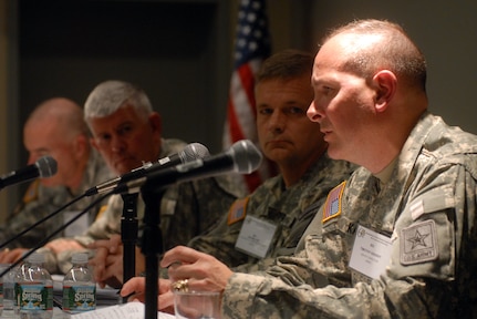 Army Gen. William "Kip" Ward, commander of U.S. Africa Command, talks with retired Army Lt. Gen. John Conaway at the 2010 Association of the U.S. Army Annual Meeting and Exposition in Washington, D.C., on Oct. 25, 2010. Ward praised the National Guard State Partnership Program's contribution to AFRICOM; Conaway is considered one of the fathers of the program, which was established during his tenure as chief of the National Guard Bureau from 1990 to 1993.