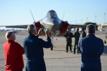 Danny Williams, 47th Student Squadron Simulator instructor, captures images of the F-35 Lightning II sits at Laughlin Air Force Base, Texas, May 1, 2015. The two F-35’s are based out of the 61st Fighter Squadron, nicknamed “Top Dogs”, at Luke Air Force Base, Arizona. (U.S. Air Force photo by Tech. Sgt. Steven R. Doty)