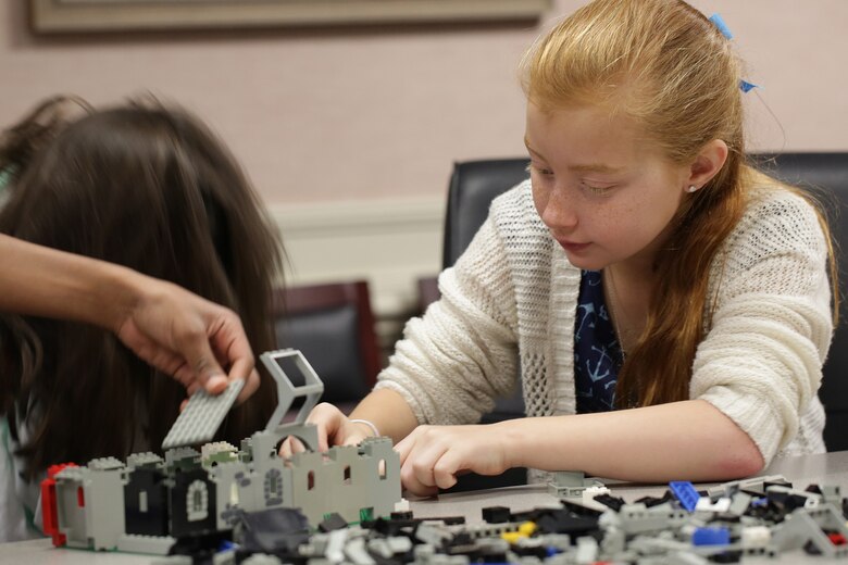 During the district’s Take our Daughters and Sons to Work Day held May 1, students use Legos to construct buildings as part of a structural engineering lesson. Participants discovered the district’s expansive footprint on public works projects throughout the Southeast and also tapped into large-scale efforts such as the Savannah Harbor Expansion Project, dam operations, wetlands restoration projects and other salient initiatives during the four-hour event.