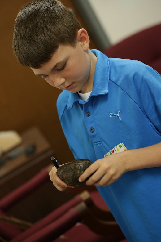 A participant handles a box turtle shell during the Take our Daughters and Sons to Work Day held May 1. Organizers reintroduced the TODS program here in 2014 as an outreach program tailored for youth ages 8-14. The Corps promotes the day in conjunction with STEM outreach objectives and to expose dependents to their caretakers’ work environment. 
