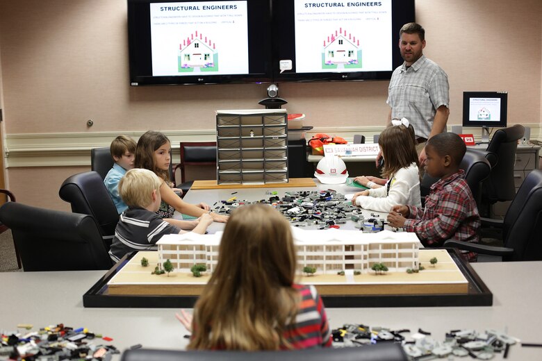 During the district’s Take our Daughters and Sons to Work Day held May 1, students use Legos to construct buildings as part of a structural engineering lesson. Participants discovered the district’s expansive footprint on public works projects throughout the Southeast and also tapped into large-scale efforts such as the Savannah Harbor Expansion Project, dam operations, wetlands restoration projects and other salient initiatives during the four-hour event.