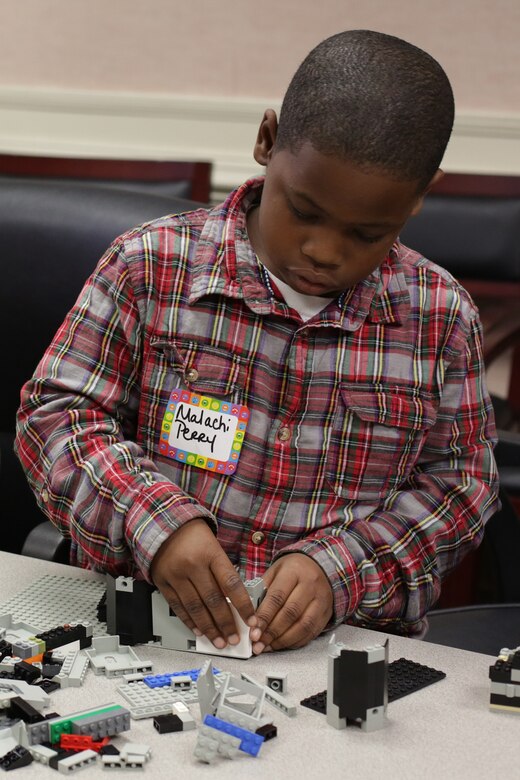 During the district’s Take our Daughters and Sons to Work Day held May 1, students use Legos to construct buildings as part of a structural engineering lesson. Participants discovered the district’s expansive footprint on public works projects throughout the Southeast and also tapped into large-scale efforts such as the Savannah Harbor Expansion Project, dam operations, wetlands restoration projects and other salient initiatives during the four-hour event.