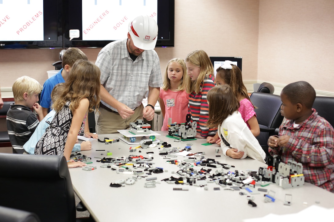 During the district’s Take our Daughters and Sons to Work Day held May 1, students use Legos to construct buildings as part of a structural engineering lesson. Participants discovered the district’s expansive footprint on public works projects throughout the Southeast and also tapped into large-scale efforts such as the Savannah Harbor Expansion Project, dam operations, wetlands restoration projects and other salient initiatives during the four-hour event.