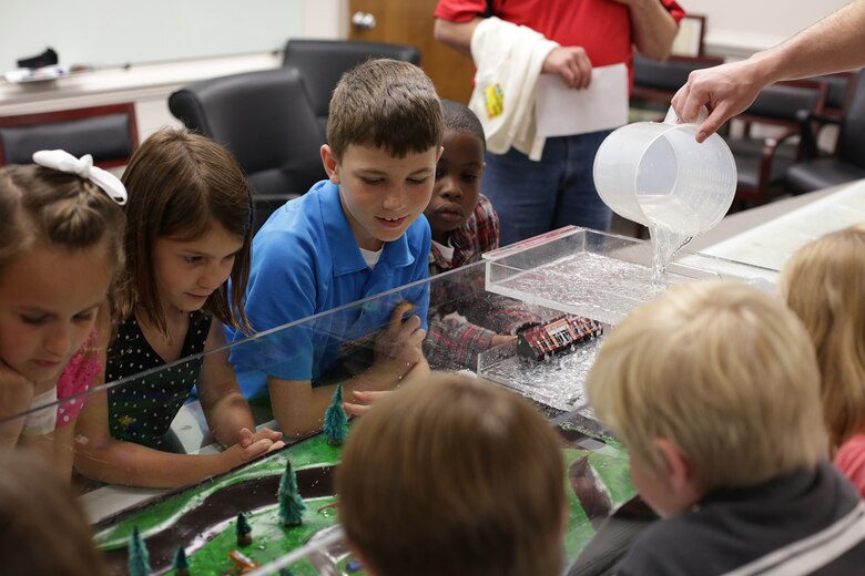 Participants of the district’s Take our Daughters and Sons to Work Day held May 1 view an interactive wetlands model to learn how wetlands protect the environment. Facilitators guided participants through age-appropriate breakout sessions as students discovered the district’s expansive footprint on public works projects throughout the Southeast. They also toured facilities and learned about large-scale projects such as the Savannah Harbor Expansion Project, dam operations and other salient initiatives.