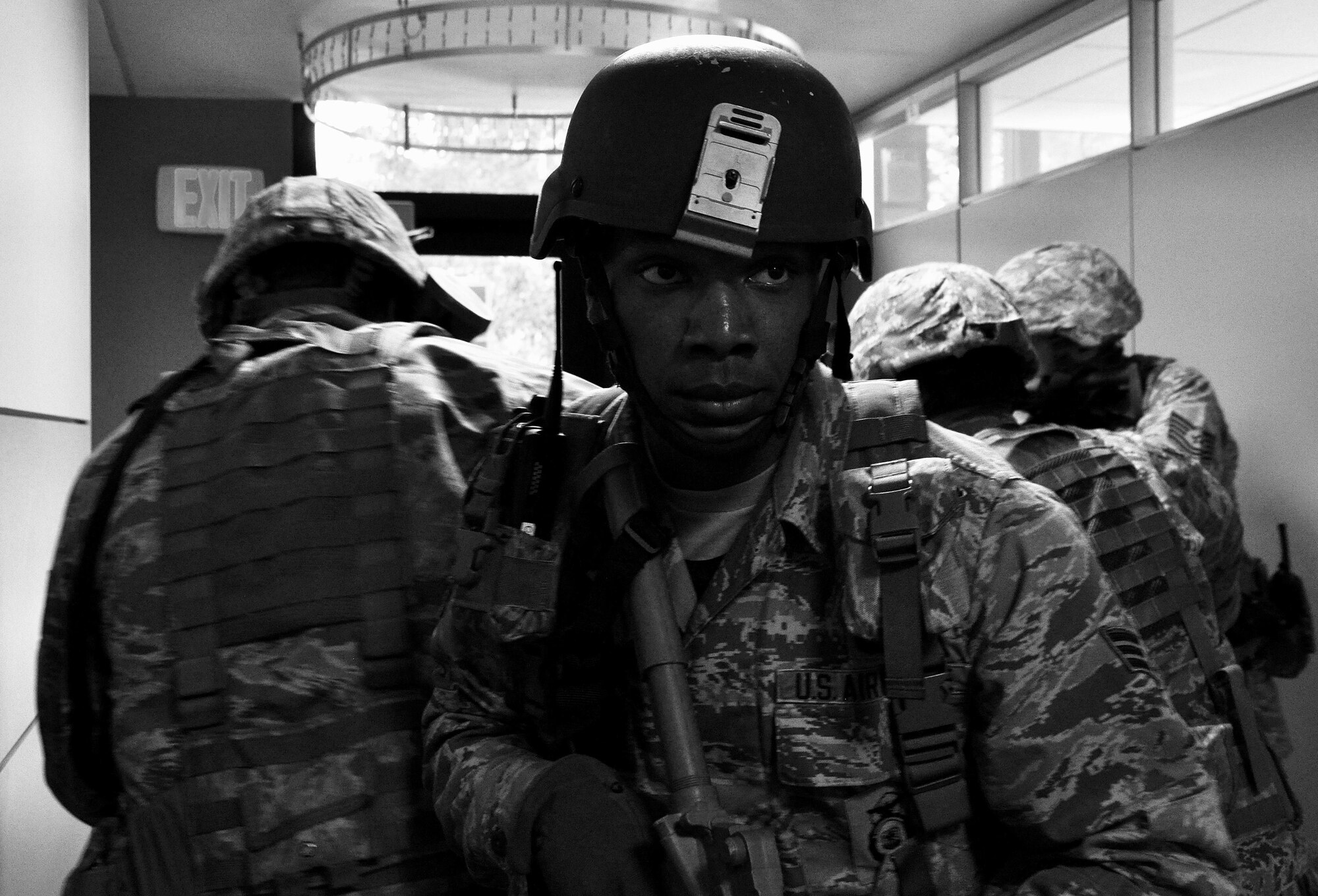 Senior Airman Gerald Jordan, 94th Security Forces Squadron member, watches the backs of his fellow Defenders as they sweep the hallways of the 94th Aeromedical Staging Squadron searching for any potential threats after taking down the active shooter during a training exercise April 23, 2015, at Dobbins Air Reserve Base, Ga. The purpose of the active shooter exercise was a follow-on to a table top exercise held in May last year. (U.S. Air Force photo/Senior Airman Daniel Phelps)