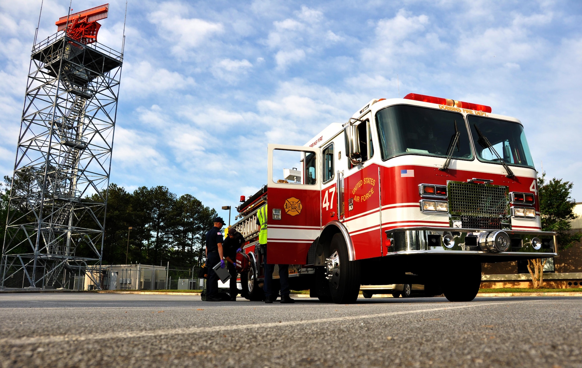 Dobbins Firefighters prepare to enter a building after it has been cleared by 94th Security Forces member during an active shooter training exercise April 23, 2015, at Dobbins Air Reserve Base, Ga. The purpose of the active shooter exercise was a follow-on to a table top exercise held in May last year. (U.S. Air Force photo/Senior Airman Daniel Phelps)