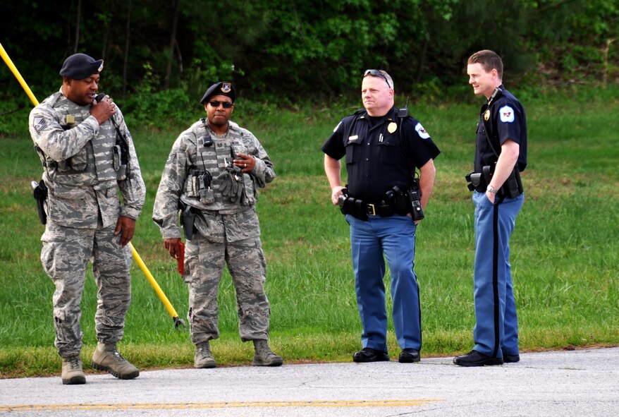Members of the 94th Security Forces Squadron and Cobb County police department secure the area around the “crime scene”  during an active shooter training exercise April 23, 2015, at Dobbins Air Reserve Base, Ga. This active shooter exercise included all tenant units at Dobbins ARB and the Cobb County Police Department working together to respond to an emergency situation. The purpose of the active shooter exercise was a follow-on to a table top exercise held in May last year. (U.S. Air Force photo/Senior Airman Daniel Phelps)