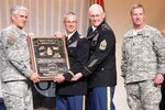From left to right, Gen. George W. Casey, Jr., chief of staff of the Army, Lt. Col. Doug Messner, 1st Sgt. Ernest T. Miller and Sgt. Maj. of the Army Kenneth O. Preston present the Walter T. Kerwin, Jr. Readiness Award for Army's Most Outstanding National Guard Unit to the senior leaders of the Virginia National Guard's Gate City-based 1030th Transportation Battalion, 329th Regional Support Group, at the Association of the U.S. Army's annual meeting in Washington, D.C., Oct. 26, 2010.
