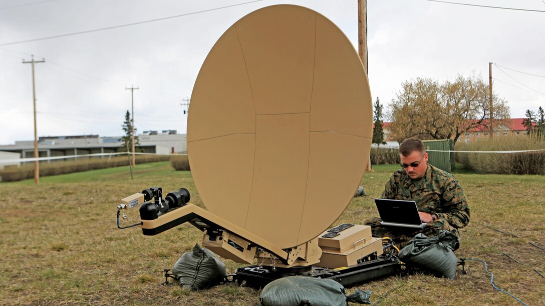 Sgt. Timothy Shirey, the data chief with 1st Air Naval Gunfire Liaison Company, evaluates and checks signal strength on a rapid response kit during Exercise Maple Resolve 15 aboard Camp Wainwright Canadian Maneuver Training Center, Alberta, May 3, 2015. The Marines used the exercise to develop a knowledge platform to train for future operations and integrate with allied forces. 