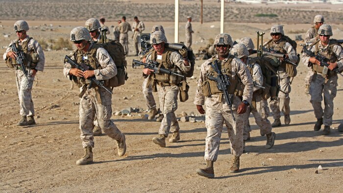 Marines with Ground Combat Element Integrated Task Force, step off for a team movement during a Marine Corps Operational Test and Evaluation Activity assessment at Range 107, Marine Corps Air Ground Combat Center Twentynine Palms, California April 23, 2015. From October 2014 to July 2015, the GCEITF will conduct individual and collective level skills training in designated ground combat arms occupational specialties in order to facilitate the standards-based assessment of the physical performance of Marines in a simulated operating environment performing specific ground combat arms tasks.