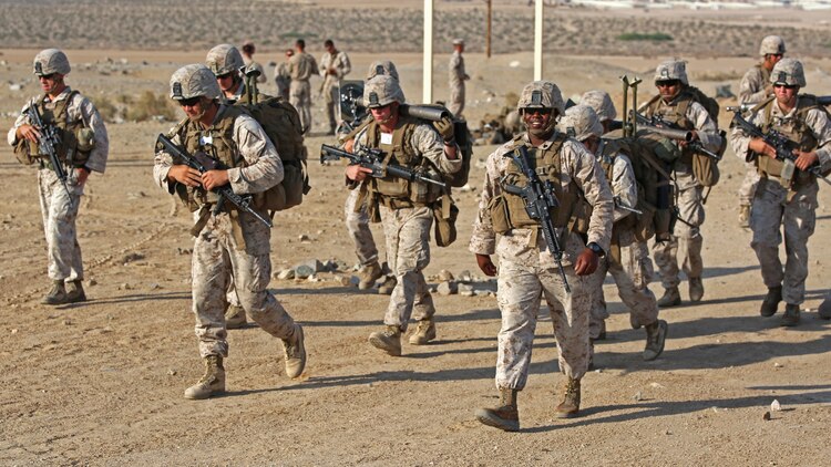 Marines with Ground Combat Element Integrated Task Force, step off for a team movement during a Marine Corps Operational Test and Evaluation Activity assessment at Range 107, Marine Corps Air Ground Combat Center Twentynine Palms, California April 23, 2015. From October 2014 to July 2015, the GCEITF will conduct individual and collective level skills training in designated ground combat arms occupational specialties in order to facilitate the standards-based assessment of the physical performance of Marines in a simulated operating environment performing specific ground combat arms tasks.