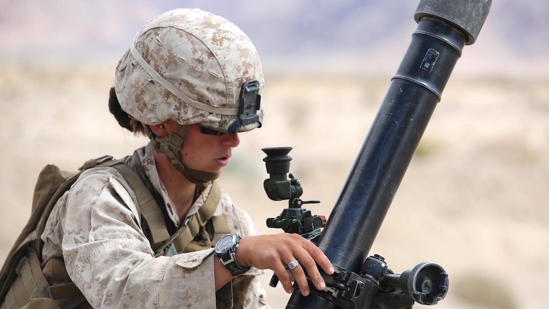 Cpl. Jacklyn Dean, mortar man, with Ground Combat Element Integrated Task Force, secures an M252 81mm medium-weight mortar during a Marine Corps Operational Test and Evaluation Activity assessment at Range 107, Marine Corps Air Ground Combat Center Twentynine Palms, California, April 24, 2015. From October 2014 to July 2015, the GCEITF will conduct individual and collective level skills training in designated ground combat arms occupational specialties in order to facilitate the standards-based assessment of the physical performance of Marines in a simulated operating environment performing specific ground combat arms tasks.