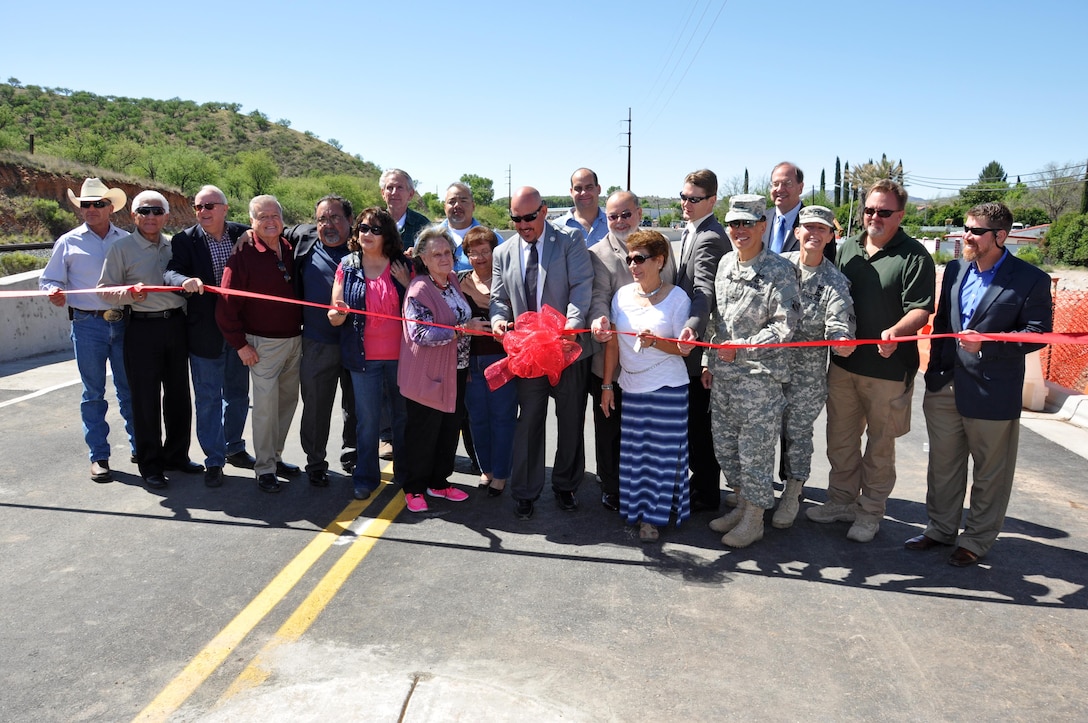 Local, county and federal officials joined Chula Vista neighborhood residents April 17 to cut the ribbon ceremonially opening the bridge spanning the Nogales Wash in Nogales, Arizona. The U.S. Army Corps of Engineers Los Angeles District constructed the $4 million bridge after the original structure was removed in 2008 as part of a flood control construction project.