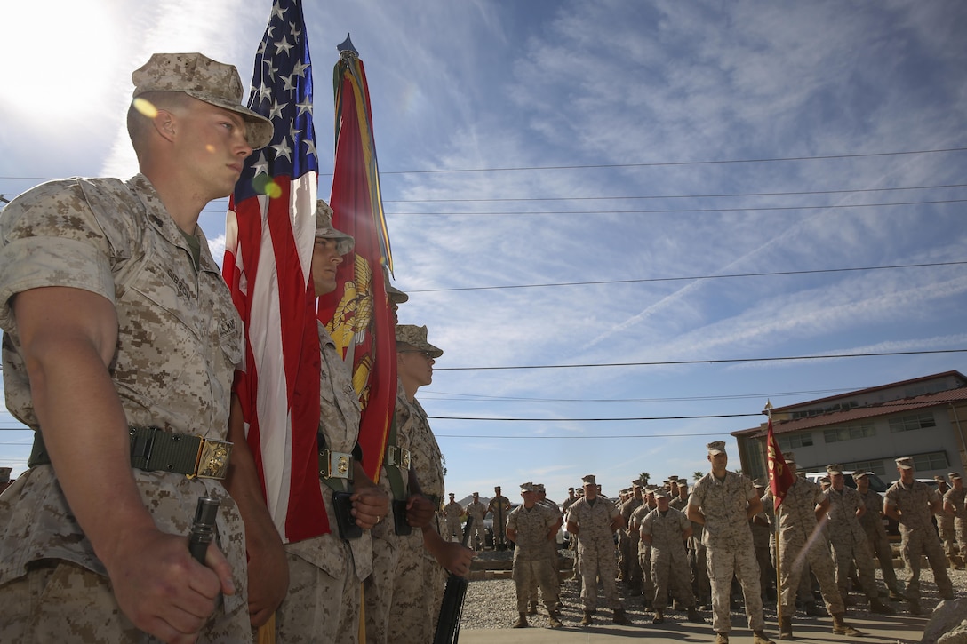 The Color Guard for 3rd Light Armored Reconnaissance Battalion stands at parade rest during a building dedication ceremony at 3rd LAR Headquarters Building, April 30, 2015. The ceremony honored Cpl. Adam A. Galvez, Light Armored Vehicle mechanic, Lance Cpl. Justin D. Reppuhn, motor transportation operator, and Seaman Chadwick T. Kenyon, corpsman, 3rd Light Armored Reconnaissance Battalion. (Official Marine Corps photo by Pfc. Levi Schultz/Released)