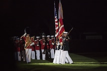 The U.S. Marine Corps Color Guard performs during a Friday evening parade at Marine Barracks Washington, D.C., May 1, 2015. The parades, which are held Friday nights during the summer months, are a means of honoring senior officials, distinguished citizens, and supporters of the U.S. Marine Corps. (U.S. Marine Corps photo by Lance Cpl. Alejandro Sierras/ Released) 