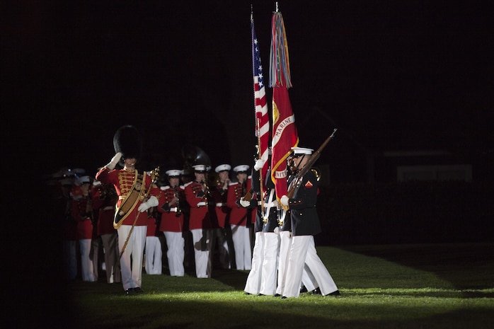 The U.S. Marine Corps Color Guard performs during a Friday evening parade at Marine Barracks Washington, D.C., May 1, 2015. The parades, which are held Friday nights during the summer months, are a means of honoring senior officials, distinguished citizens, and supporters of the U.S. Marine Corps. (U.S. Marine Corps photo by Lance Cpl. Alejandro Sierras/ Released) 