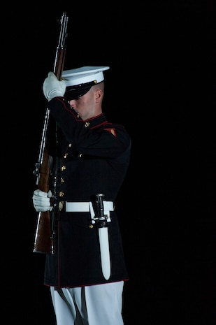 A Marine with the Silent Drill Platoon, performs during an evening parade at Marine Barracks Washington, D.C., May  1, 2015. The parades, which are held Friday nights during the summer months, are a means of honoring senior officials, distinguished citizens, and supporters of the Marine Corps. (U.S. Marine Corps photo by Lance Cpl. Kayla V. McTaw/Released)