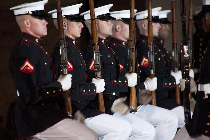 The U.S. Marine Corps Silent Drill platoon performs during an evening parade at Marine Barracks Washington, D.C., May 1, 2015. The parades, which are held Friday nights during the summer months, are a means of honoring senior officials, distinguished citizens and supporters of the Marine Corps. (U.S. Marine Corps photo by Lance Cpl. Kayla V. McTaw/Released)