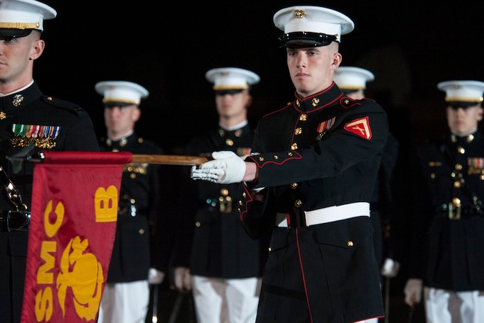 Marines from Company B, Marine Barracks Washington, D.C. perform during an evening parade at the barracks, May 1, 2015. The parades, which are held Friday nights during the summer months, are a means of honoring senior officials, distinguished citizens, and supporters of the Marine Corps. (U.S. Marine Corps photo by Lance Cpl. Kayla V. McTaw/Released)