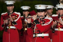 Staff Sgt. Heather Zenoba with the U.S. Marine Band, performs during an evening parade at Marine Barracks Washington, D.C., May 1, 2015. The parades, which are held Friday nights during the summer months, are a means of honoring senior officials, distinguished citizens, and supporters of the Marine Corps. (U.S. Marine Corps photo by Lance Cpl. Kayla V. McTaw/Released)