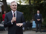 The Honorable Ray Mabus, 75th U.S. secretary of the Navy, speaks at the reception during an evening parade at Marine Barracks Washington, D.C., May 1, 2015. The parades, which are held Friday nights during the summer months, are a means of honoring senior officials, distinguished citizens, and supporters of the U.S. Marine Corps. (U.S. Marine Corps photo by Lance Cpl. Alex A. Quiles/ Released)
