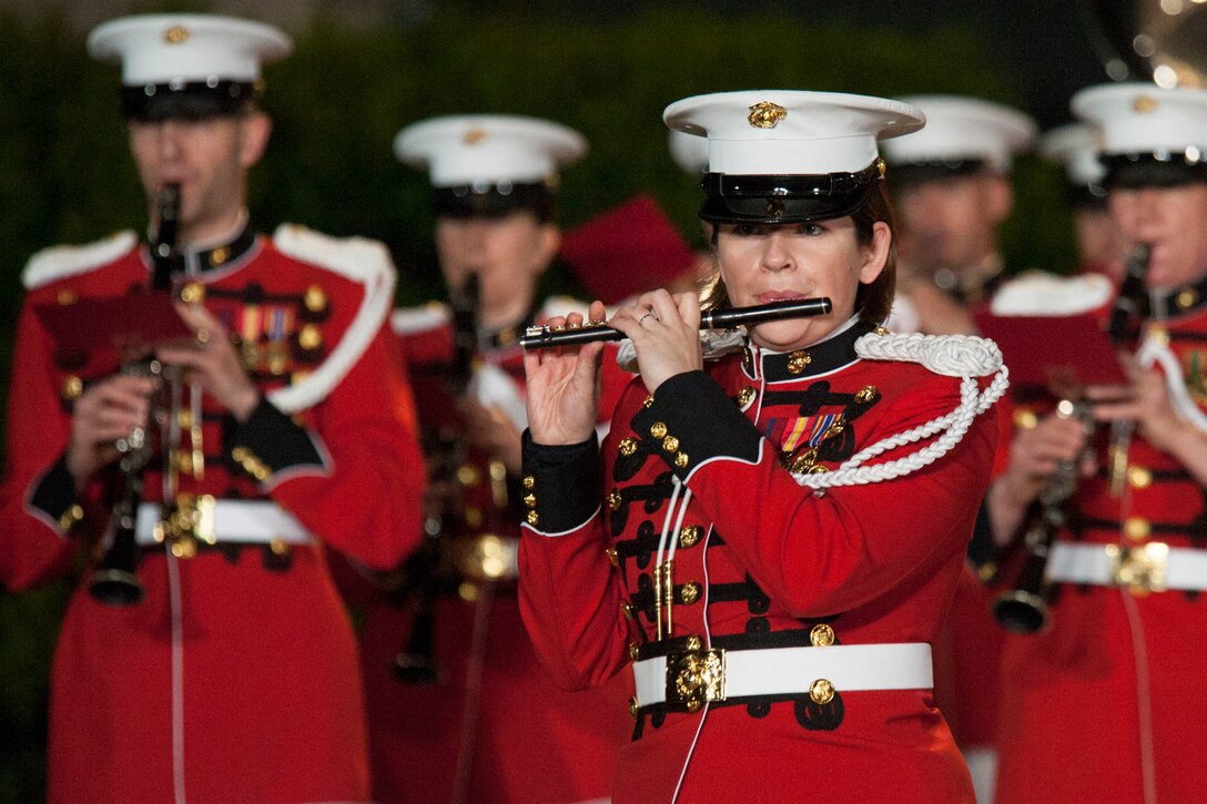 Staff Sgt. Heather Zenoba with the U.S. Marine Band, performs during an evening parade at Marine Barracks Washington, D.C., May 1, 2015. The parades, which are held Friday nights during the summer months, are a means of honoring senior officials, distinguished citizens, and supporters of the Marine Corps. (U.S. Marine Corps photo by Lance Cpl. Kayla V. McTaw/Released)