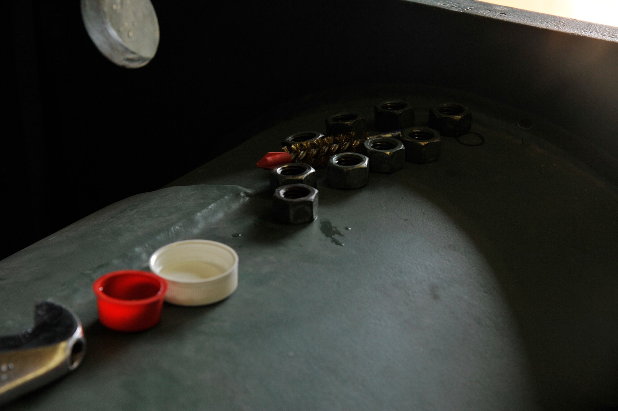 Nuts, bolts and a bore brush sit atop a chilling unit at Misawa Air Base, Japan, May 5, 2015. The chilling unit requires heavy maintenance during the summer, during which members from the 35th Civil Engineer Squadron Heating Ventilation and Air Conditioning team go out to clean, replace and restore to keep Misawa residents cool during the hot months of summer in Japan. (U.S. Air Force photo by Senior Airman Patrick S. Ciccarone/Released)