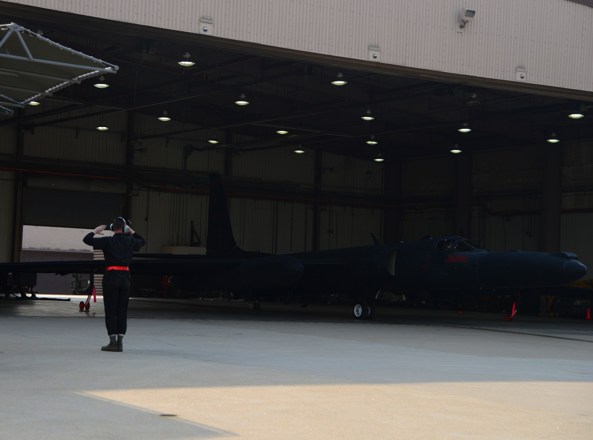 A 5th Reconnaissance Squadron crew chief marshals out a U-2 April 22, 2015, at Osan Air Base, Republic of Korea. The U-2 is a single-jet engine, ultra-high altitude reconnaissance aircraft operated by the United States Air Force and previously flown by the Central Intelligence Agency. (U.S. Air Force photo by Senior Airman Matthew Lancaster)