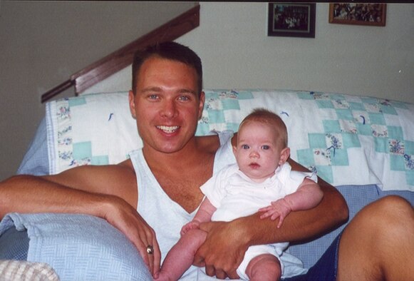 Lt. Col. Luke Lokowich, 5th Reconnaissance Squadron commander, with his daughter Avery at Barksdale AFB, La., during the summer of 2000, a few months after she was born. (Courtesy photo)